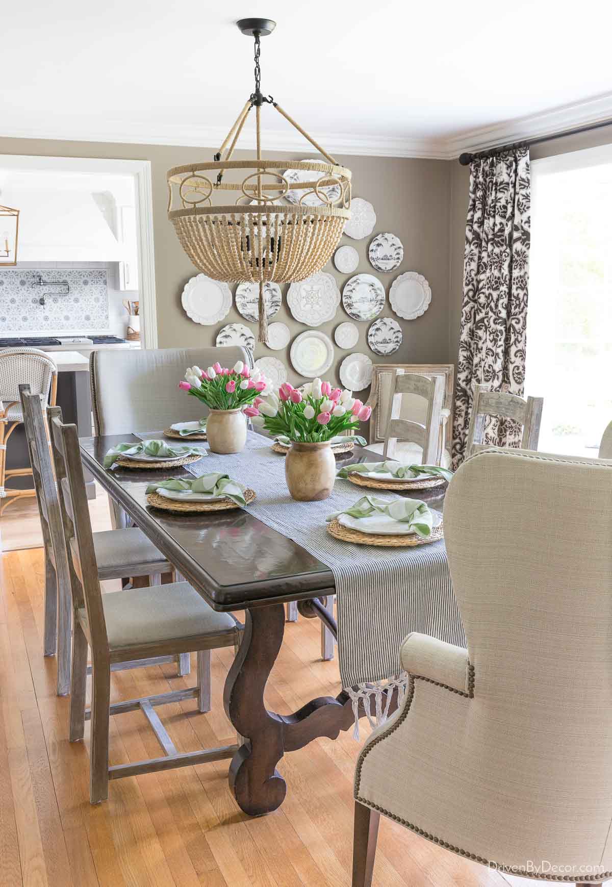 Two wood vases with faux tulips as a dining table centerpiece