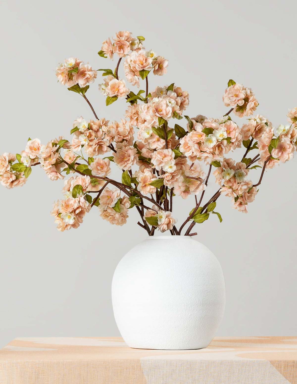 Round white vase with flowers