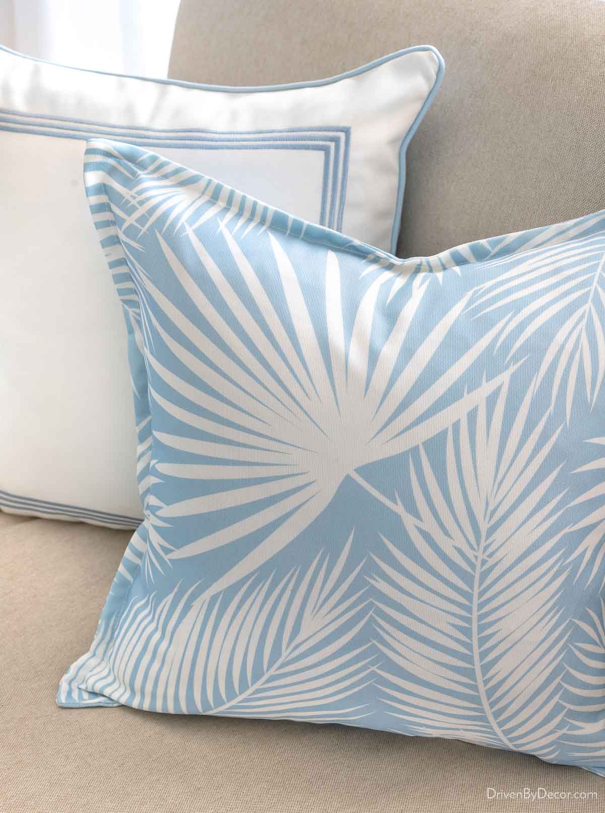 Budget-friendly pillow with light blue palm design