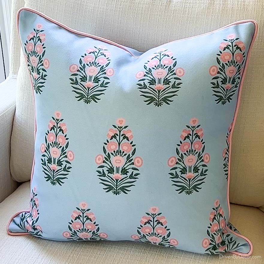 Pink and blue patterned throw pillow cover