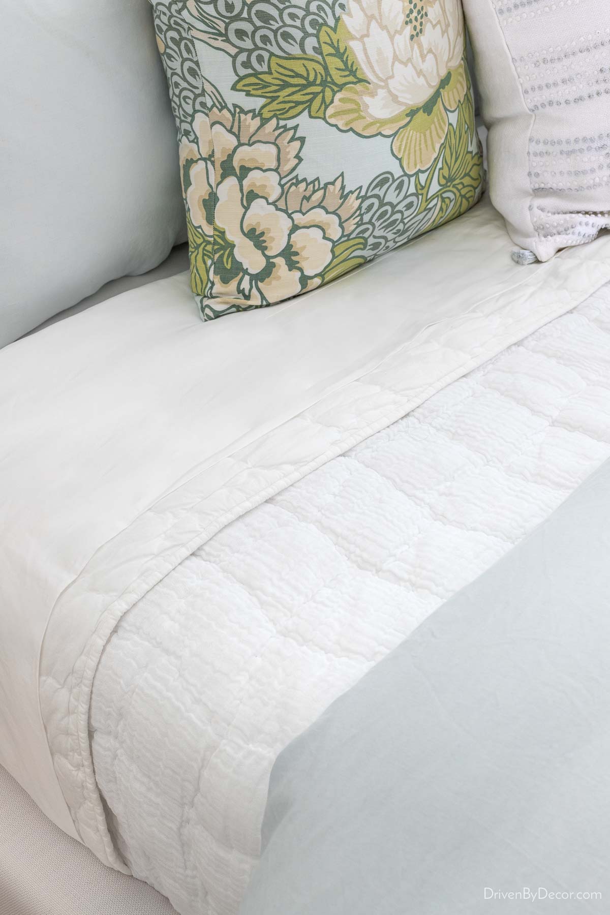 Cloud quilt layered between sheets and duvet