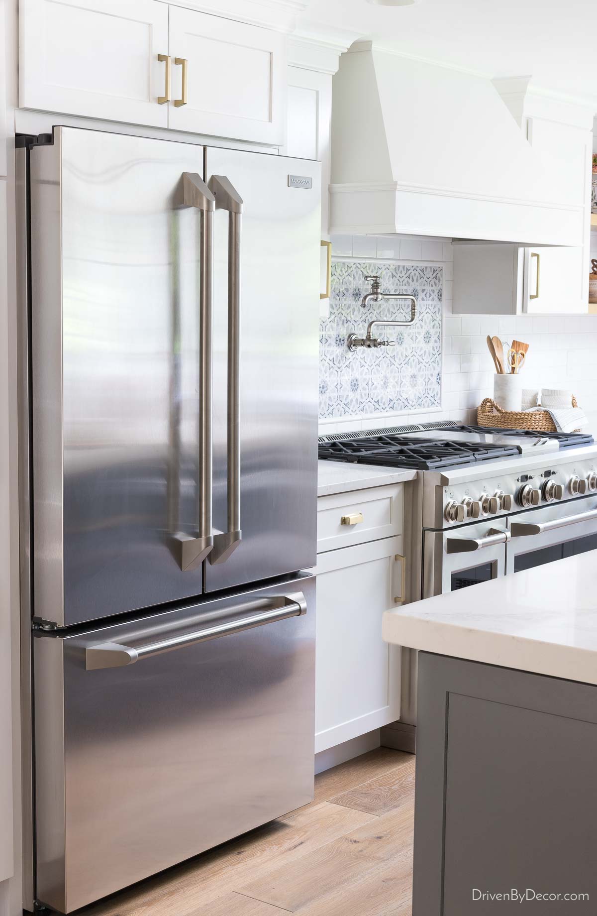 Monogram refrigerator in renovated kitchen
