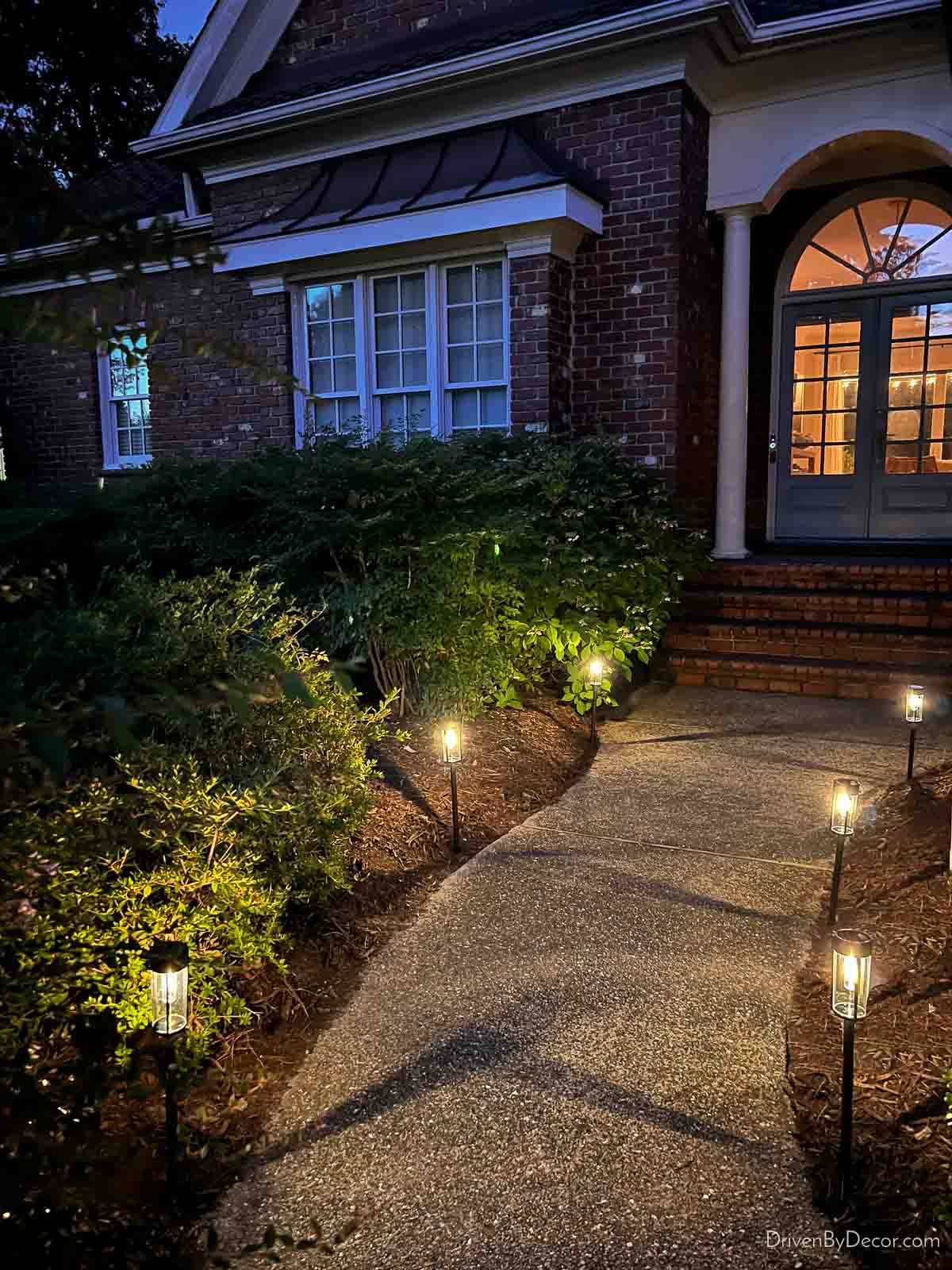 Solar walkway lights along path to front door