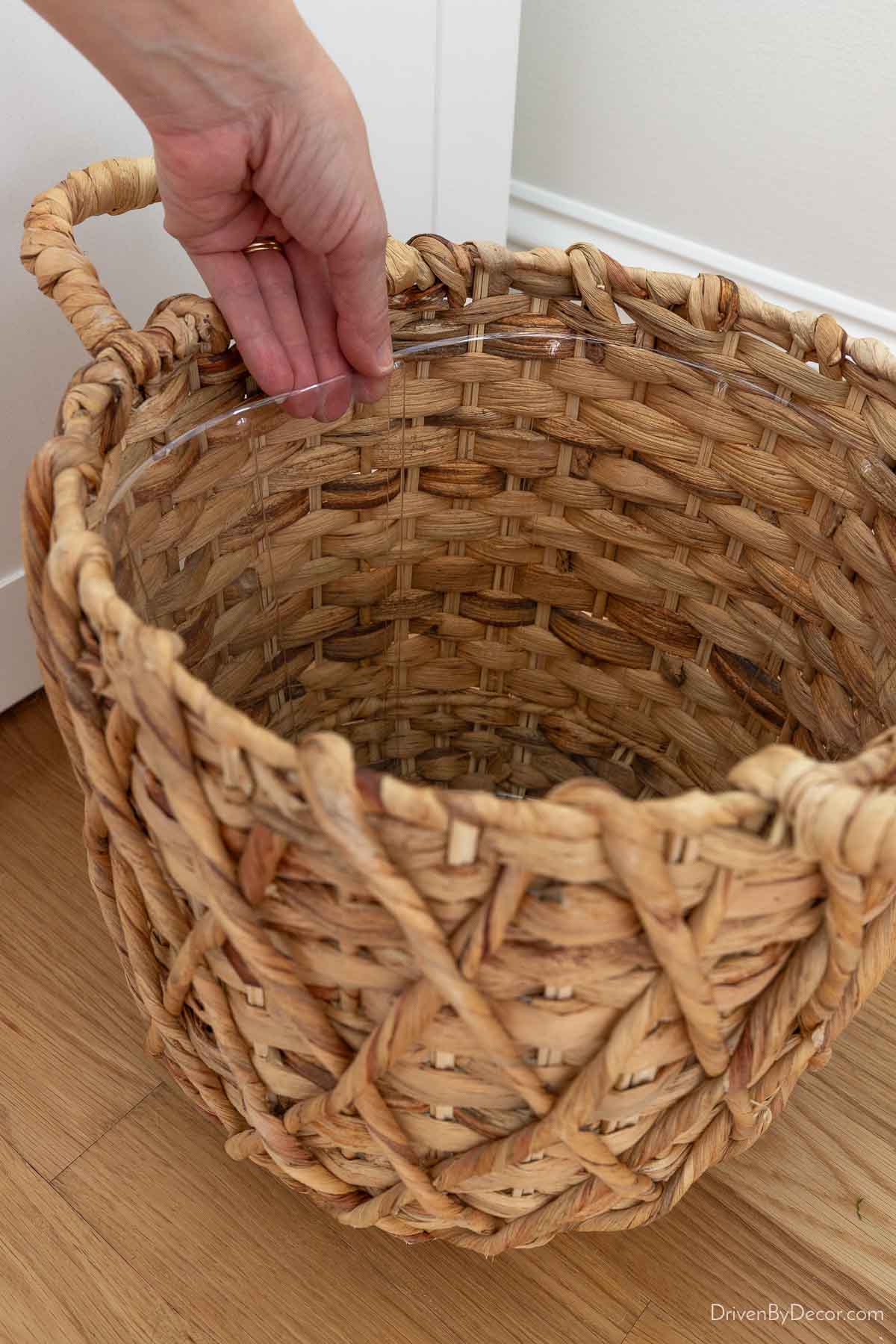 Clear plastic liner in woven planter