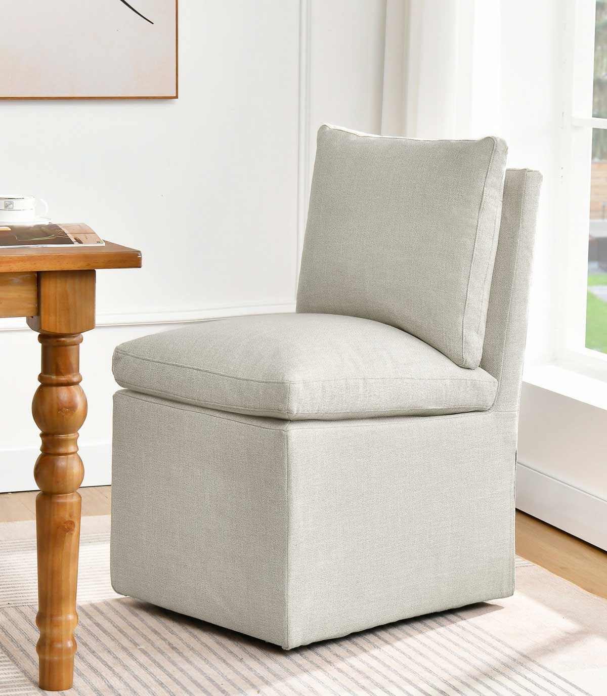 Upholstered dining chair on casters