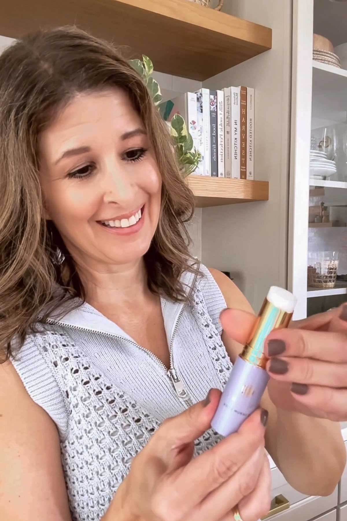 Holding Tatcha serum stick