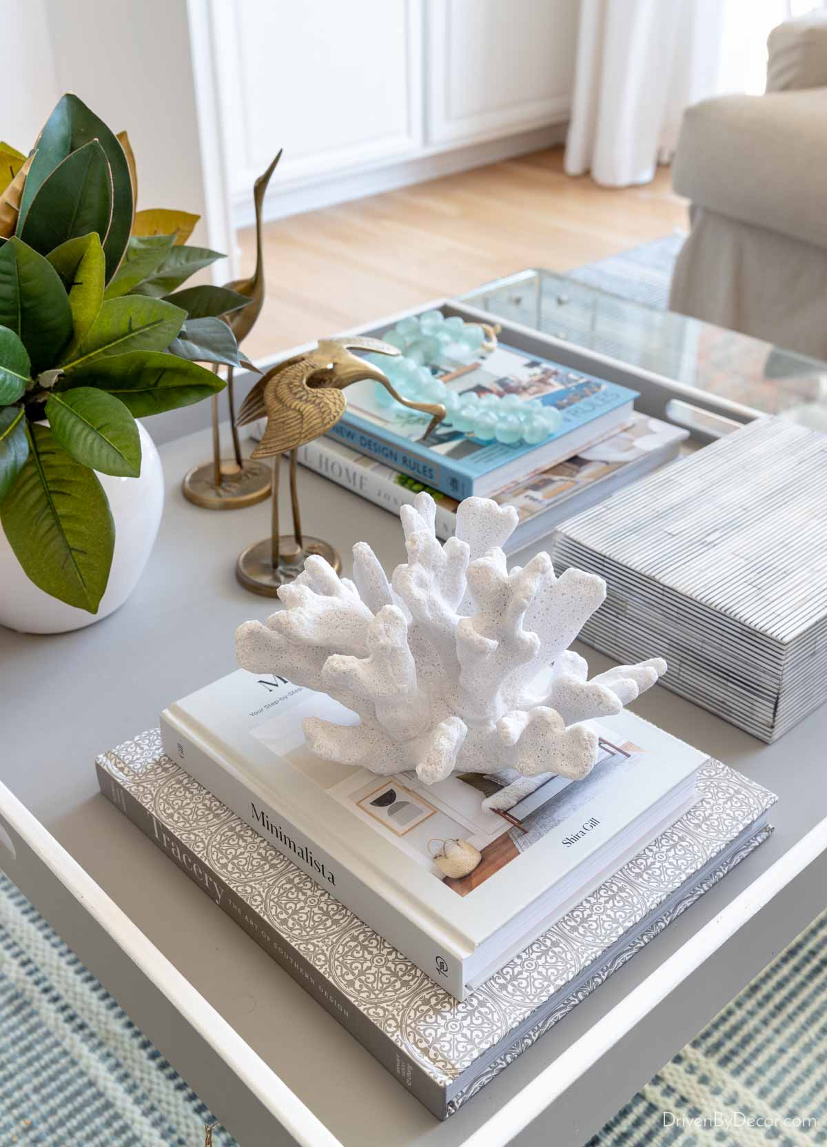 Faux coral on a stack of coffee table books