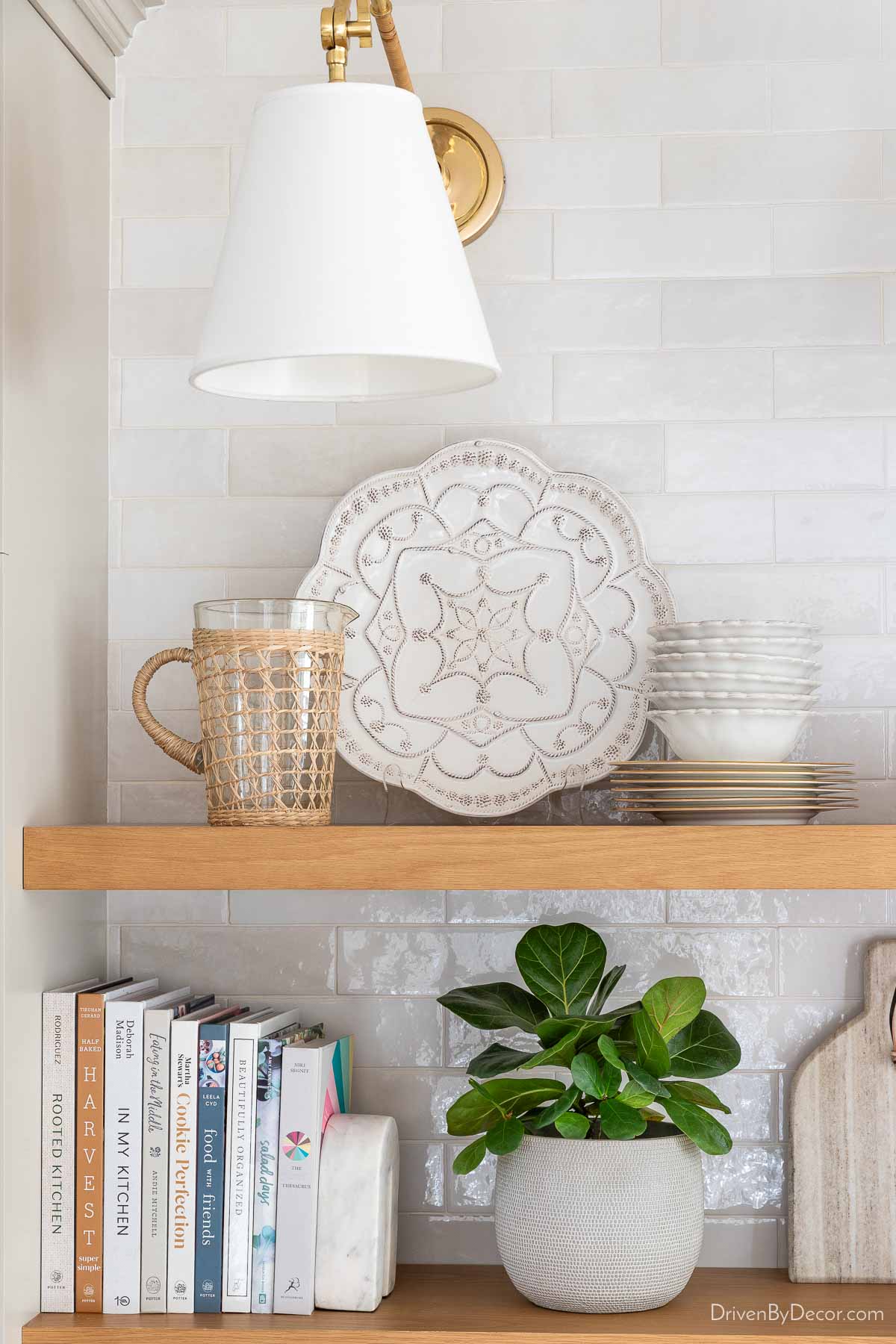 Floating shelves on our kitchen coffee bar with serving pieces displayed