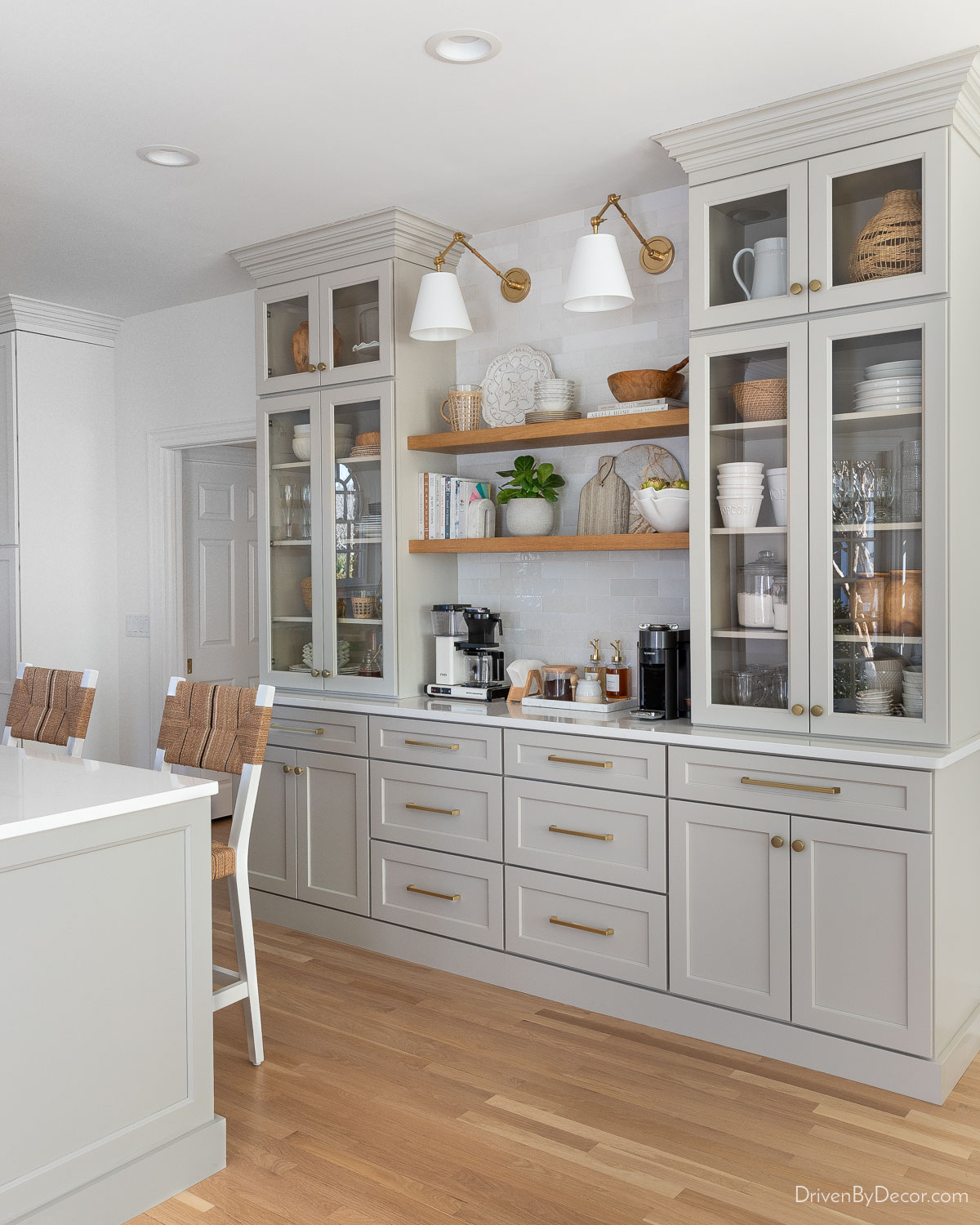 Kitchen coffee bar with gray cabinets and floating wood shelves