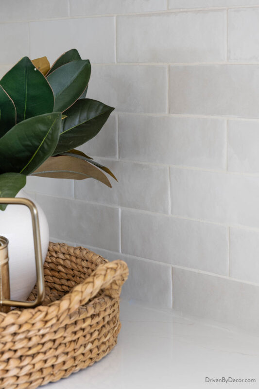 Subway tile backsplash in varied shades of white and gray