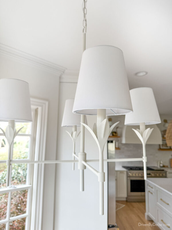 Matte white chandelier with linen shades over our kitchen table
