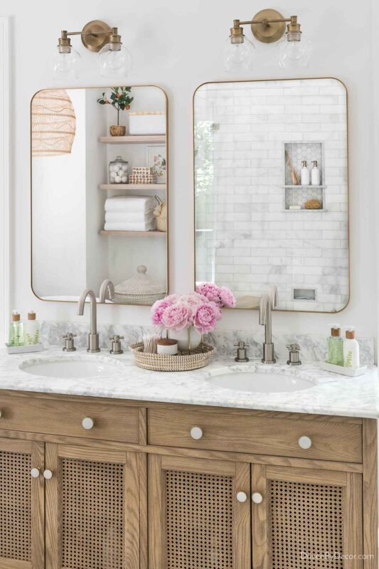 Rectangular mirrors with curved corners over double vanity