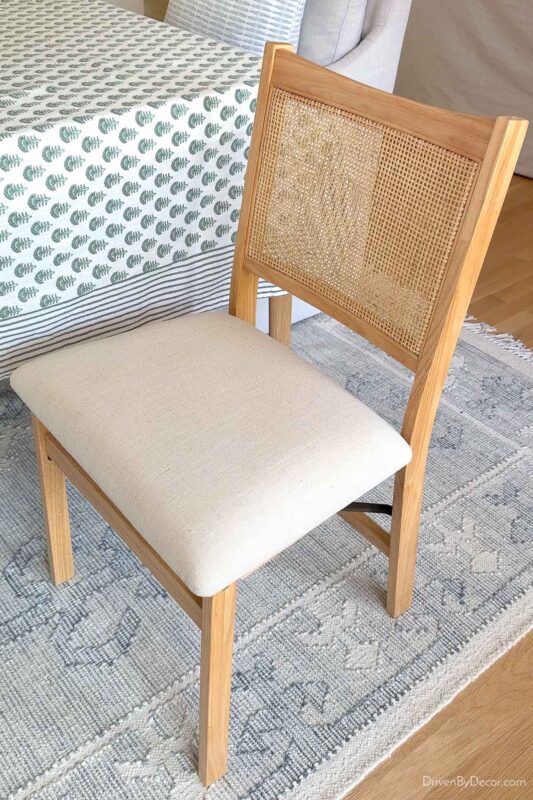 Folding dining chair with upholstered seat and woven back