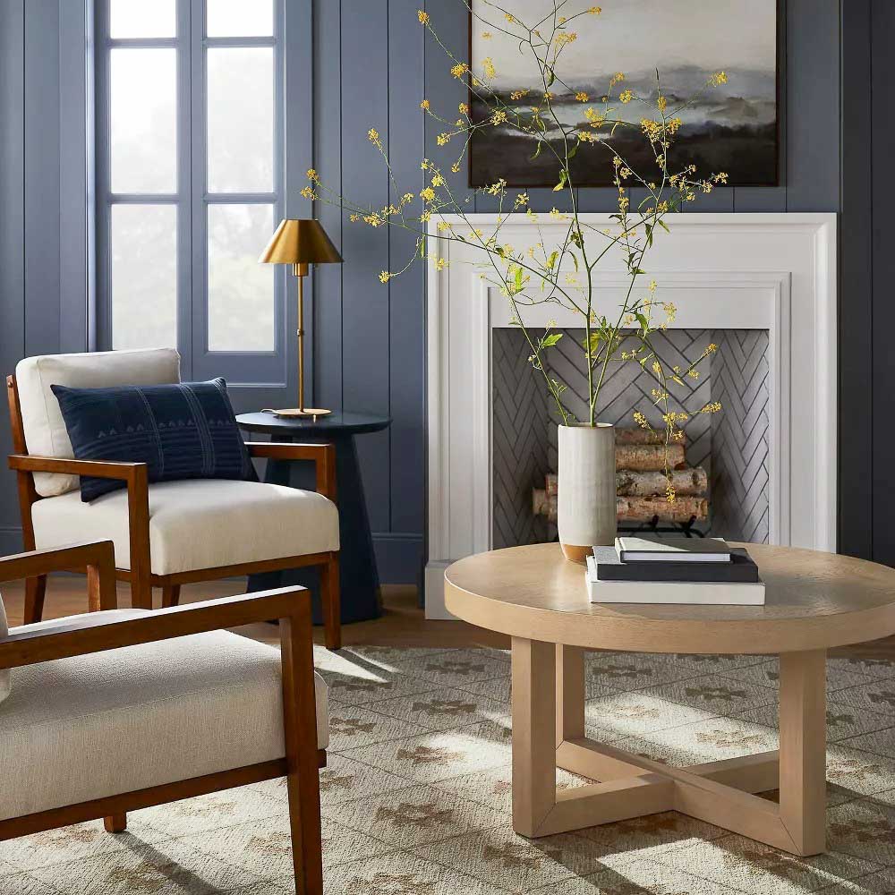 Round coffee table decorated with minimalistic decor