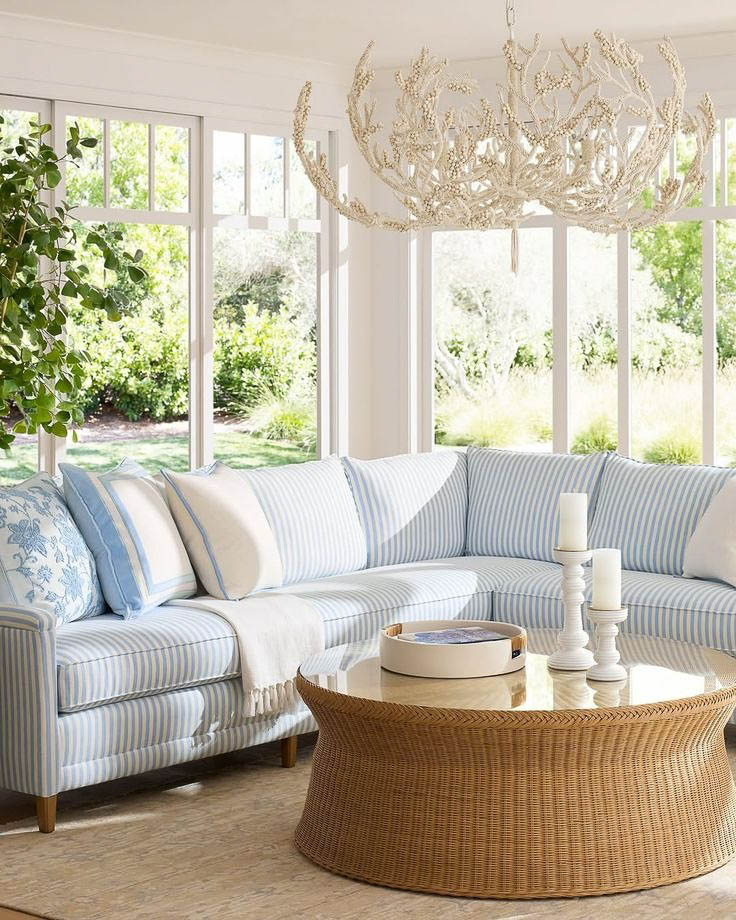 Round woven coffee table with tray and candlesticks