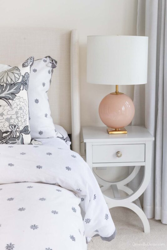 Narrow nightstand with cross base