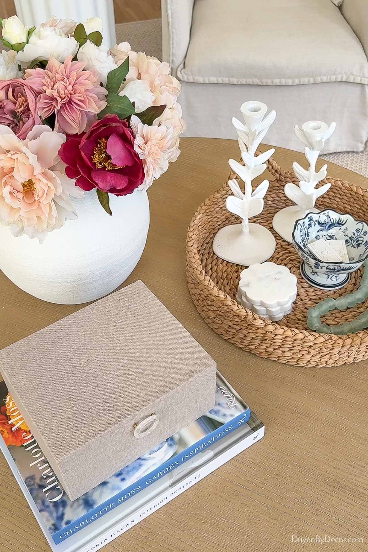 Round coffee table decor in a triangular arrangement