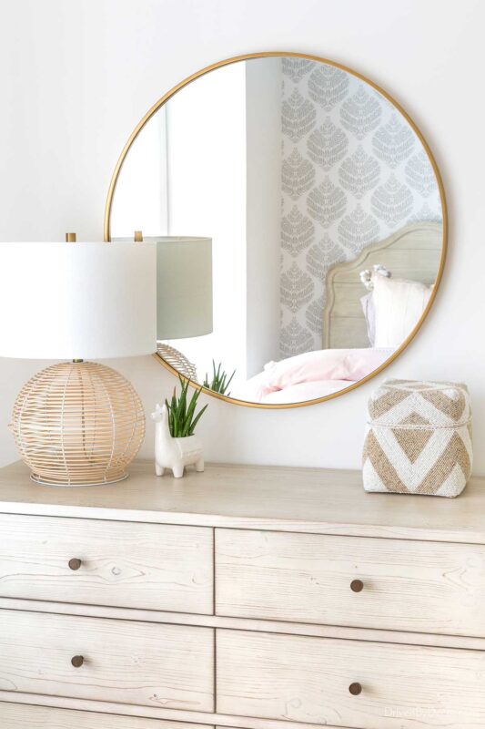 Round mirror over dresser