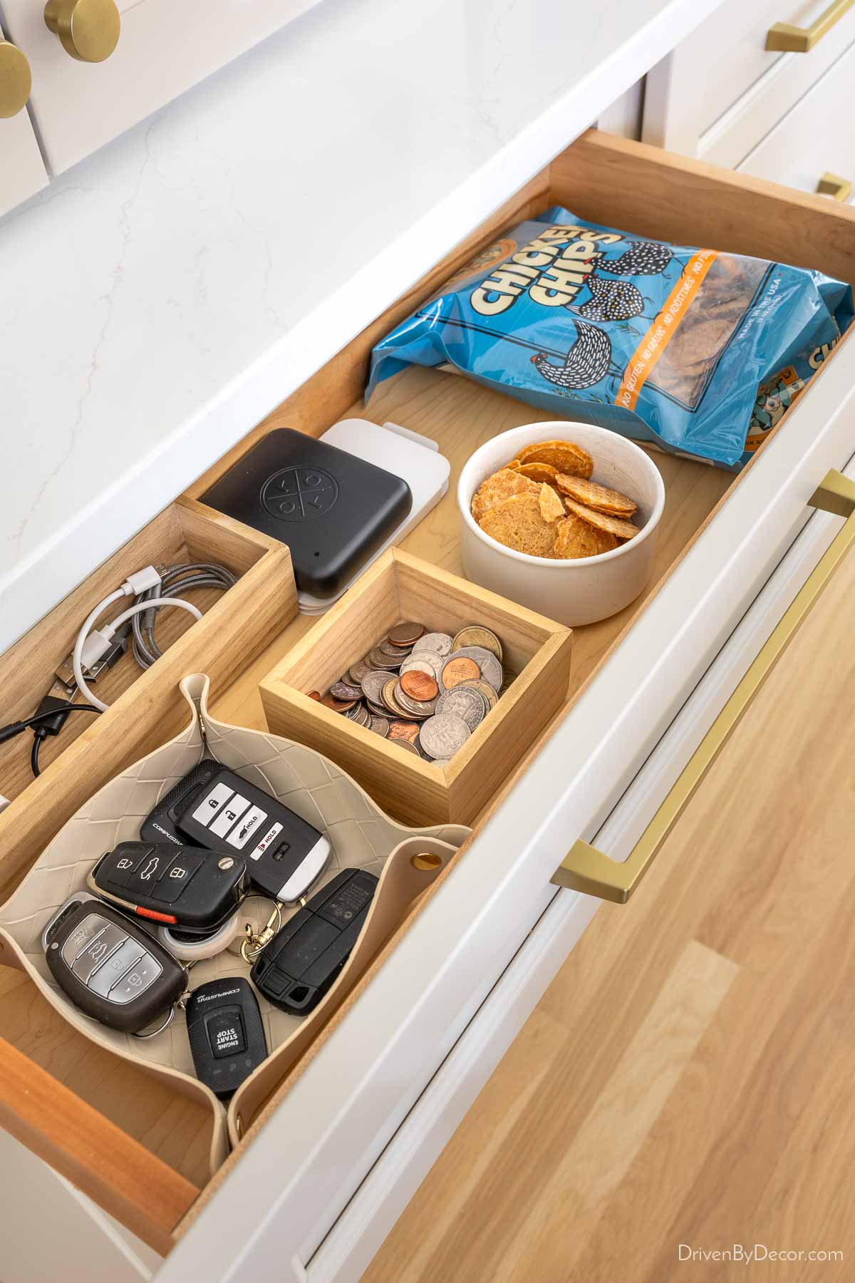 Short kitchen drawer with car keys, change, and dog treats