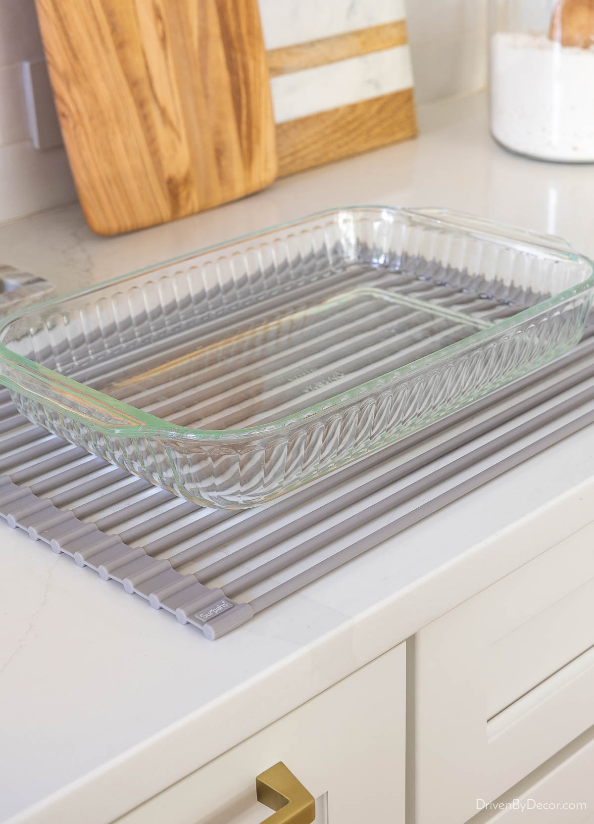 Large roll-up silicone coated trivet with baking dish