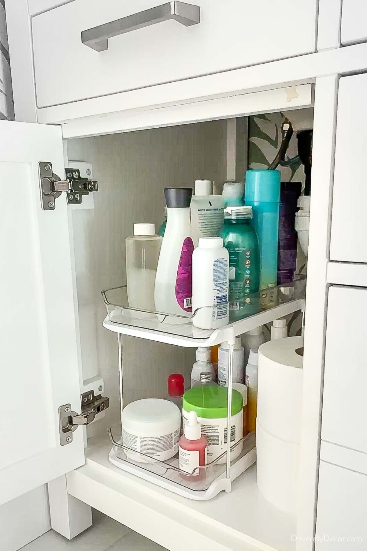 Tiered organizer in cabinet under sink