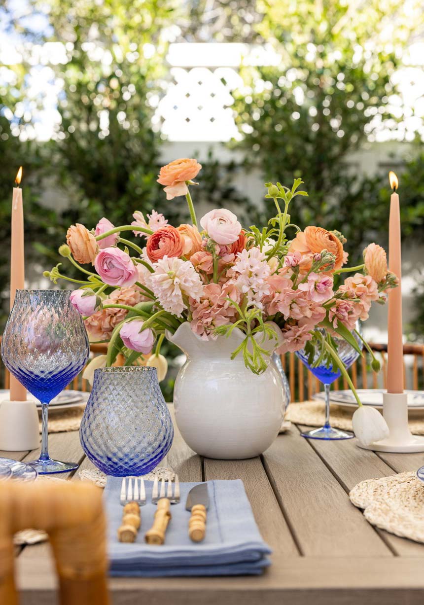Ruffle vase filled with flowers as dining table centerpiece