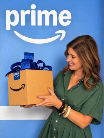 Kris with Prime Day box with bow in front of Prime logo