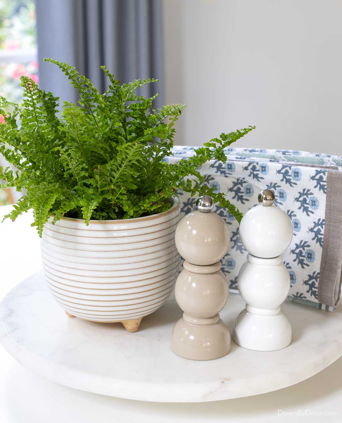 Spindle salt and pepper shakers with plant on lazy Susan