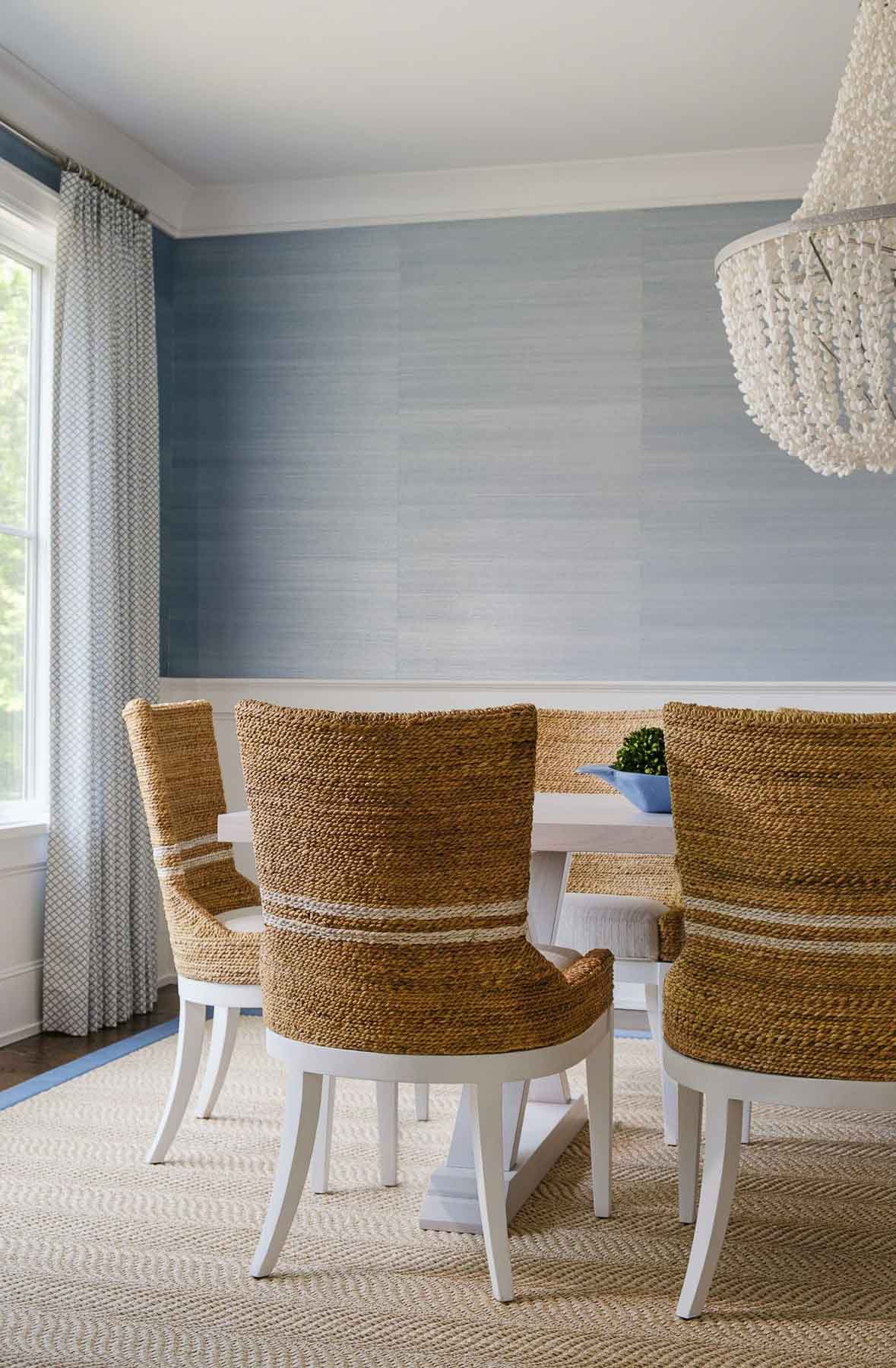 Woven dining chairs at dining table