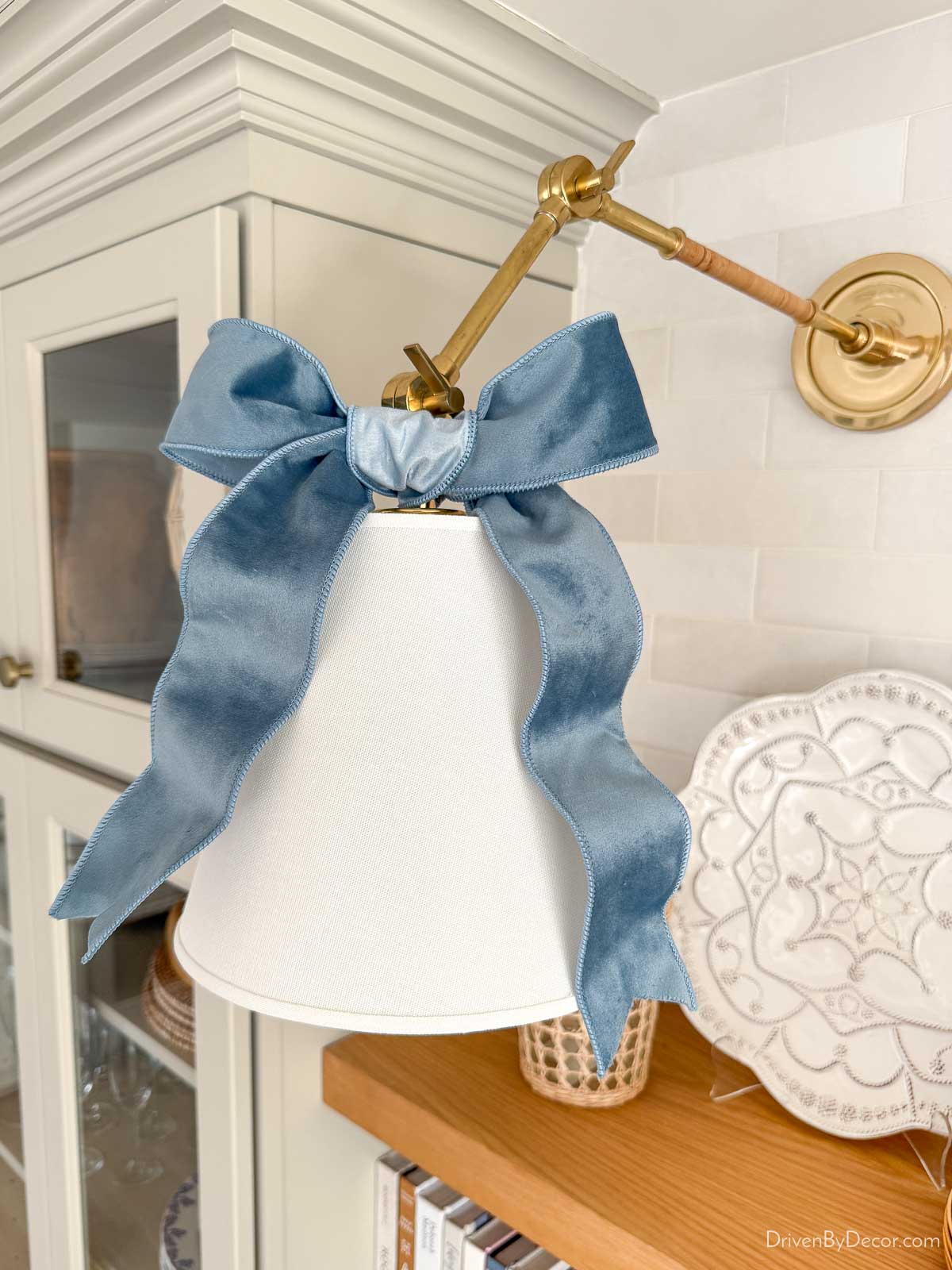 Blue velvet bow tied on coffee bar sconce
