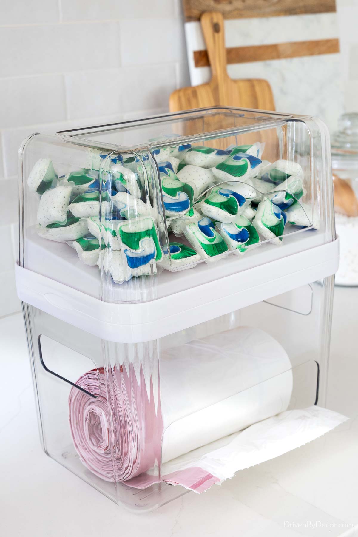 Organizer holding trash bags and dishwasher pods