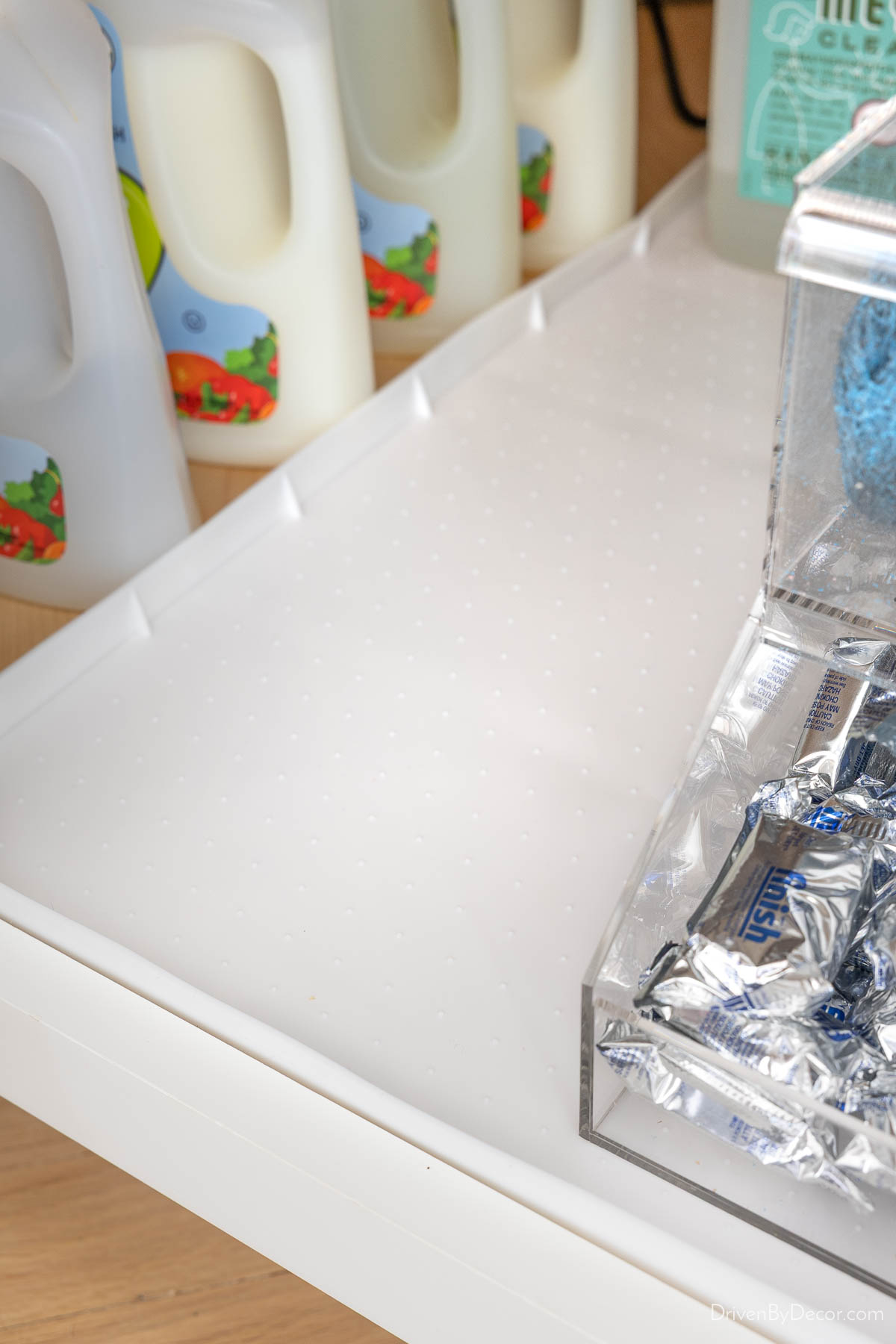 White waterproof cabinet liner under kitchen sink