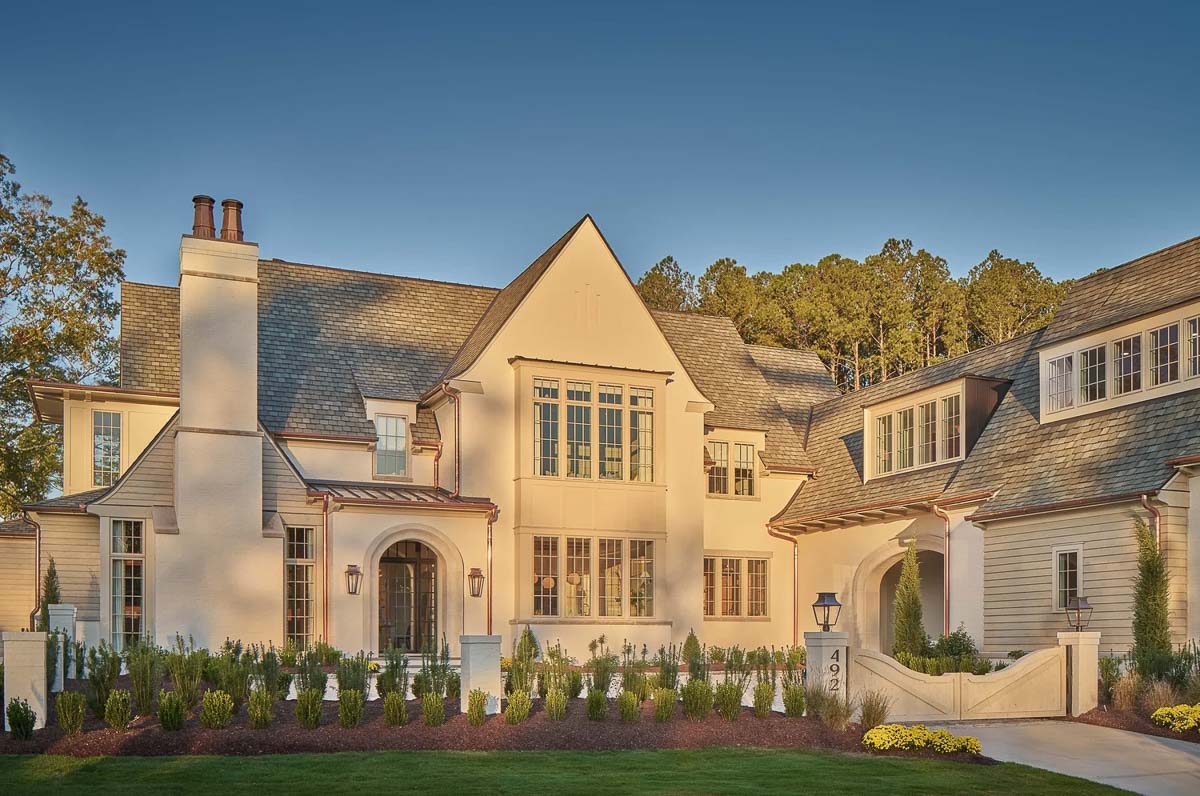 Front exterior of modern tutor home designed by by Frazier Home Design