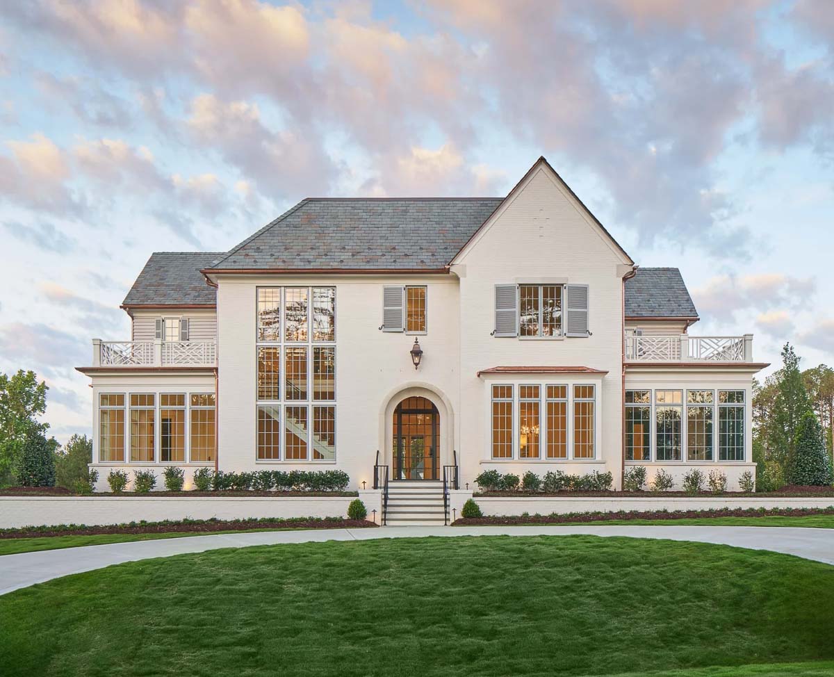 Front exterior of modern tutor home designed by by Frazier Home Design