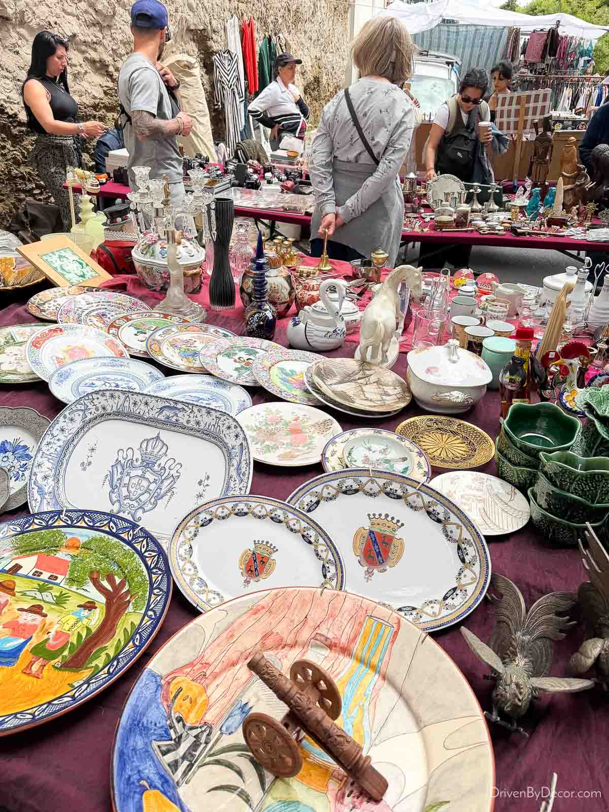 Vintage plates and other items at a Lisbon flea market
