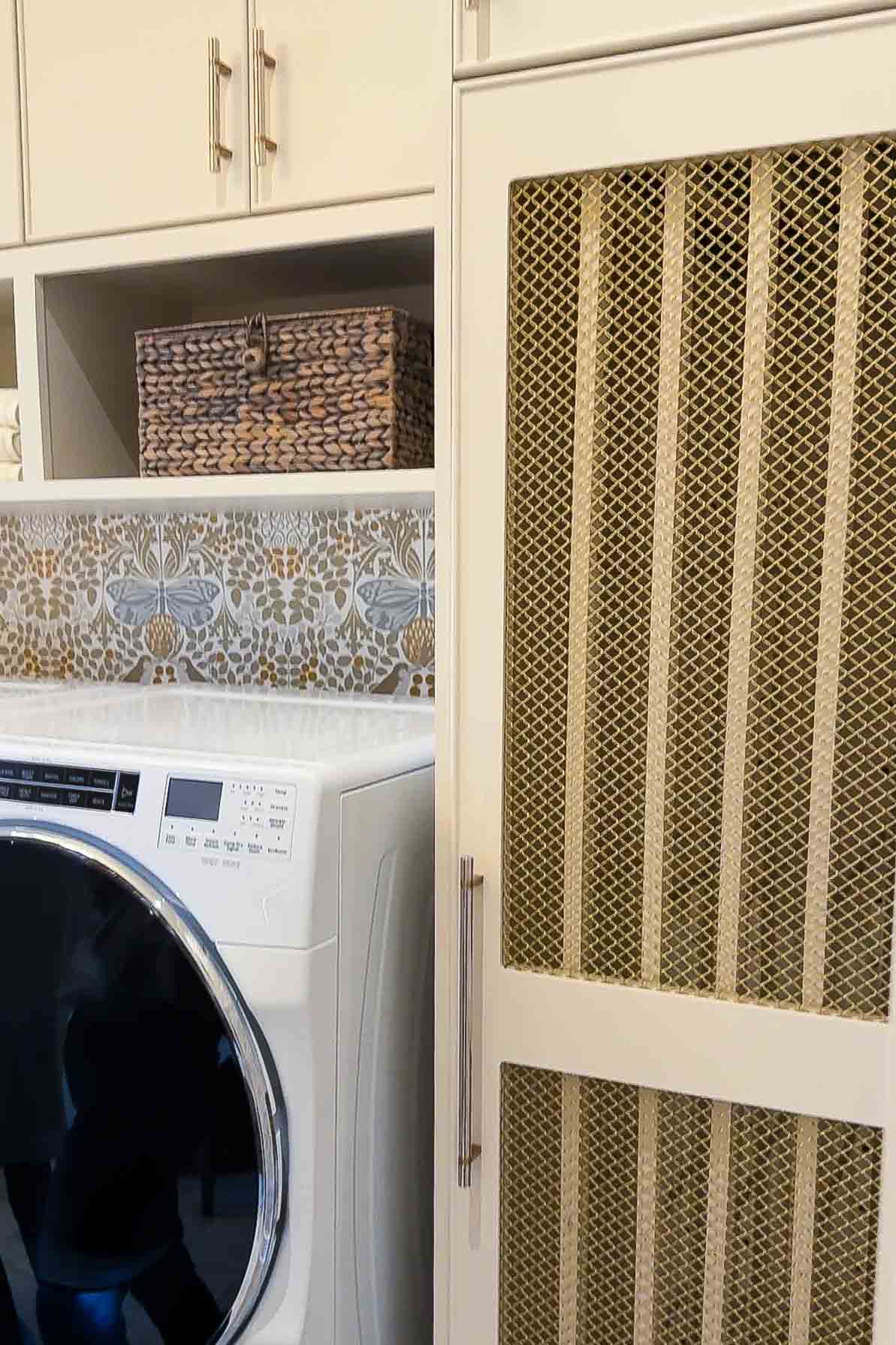 Vented laundry room cabinet with DryAway drying racks