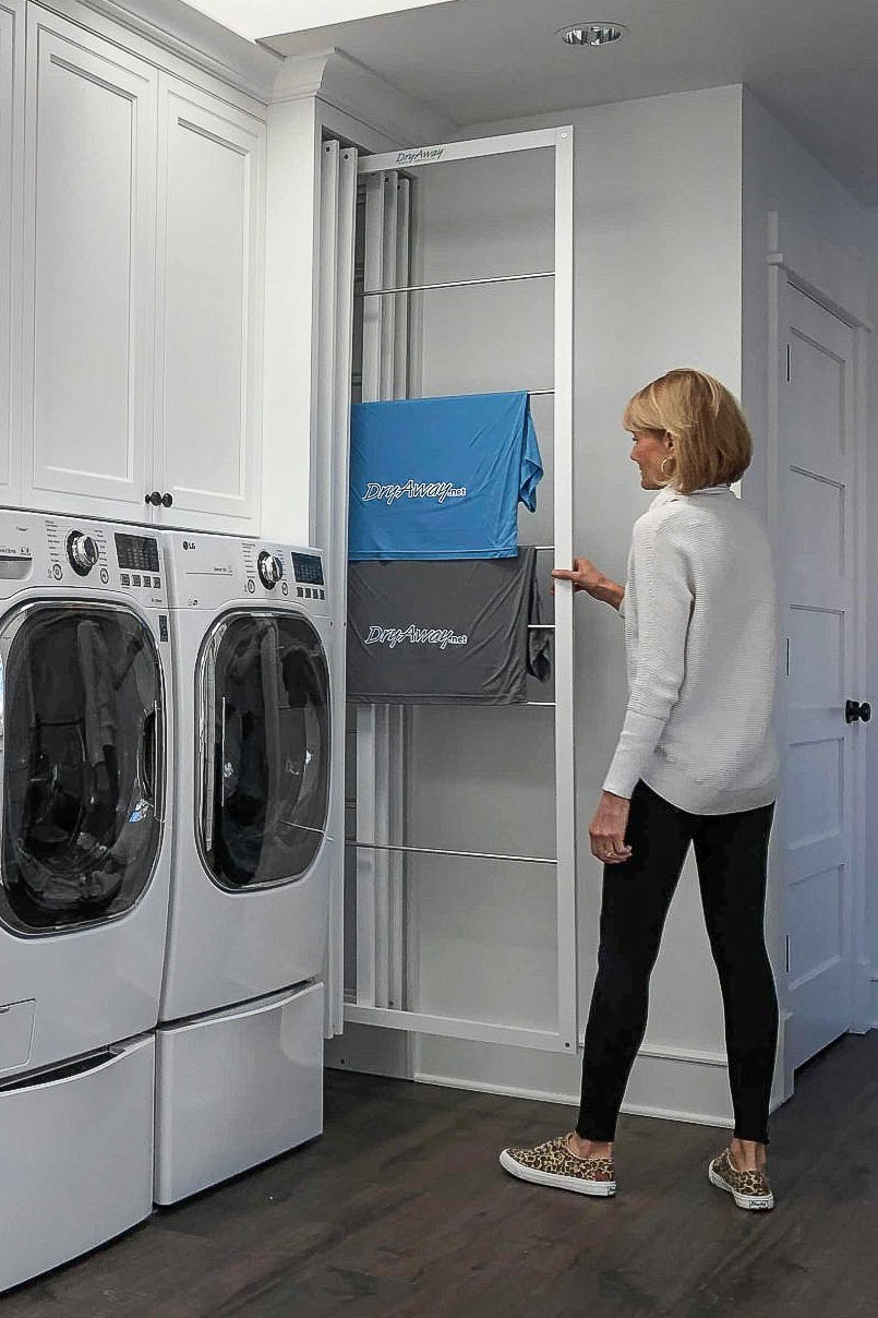 Pulling out DryAway drying racks for air drying laundry