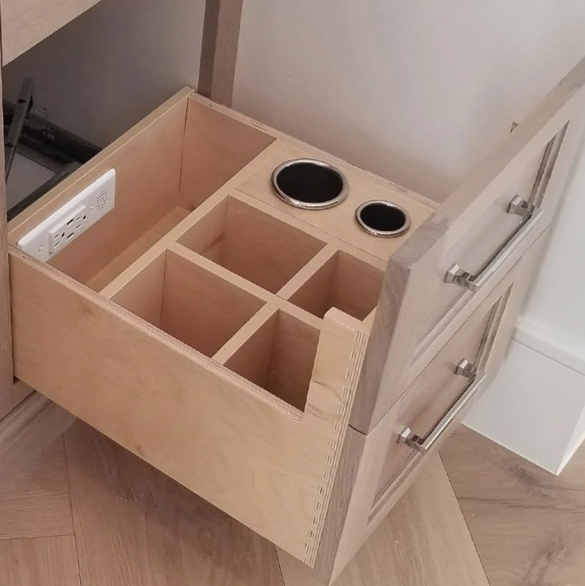 Outlet in vanity drawer for hair dryer and curling irons
