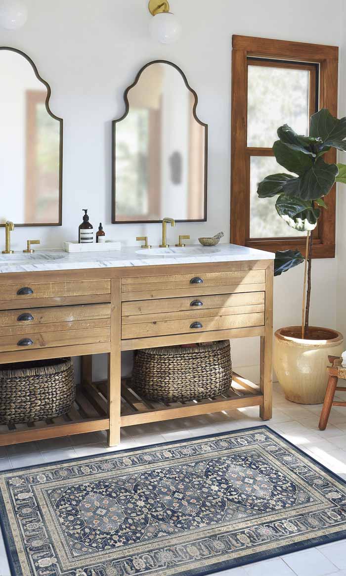 Blue patterned rug in front of bathroom vanity