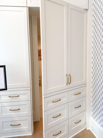 Faux cabinetry opens to reveal a secret room