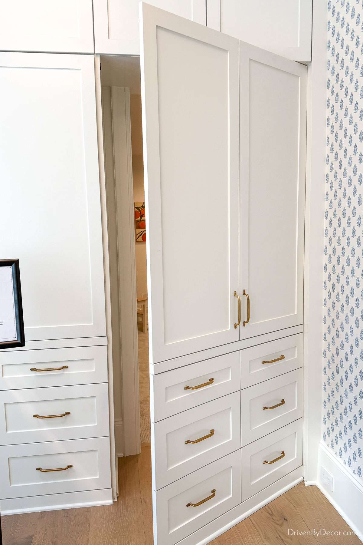 Faux cabinetry opens to reveal a secret room
