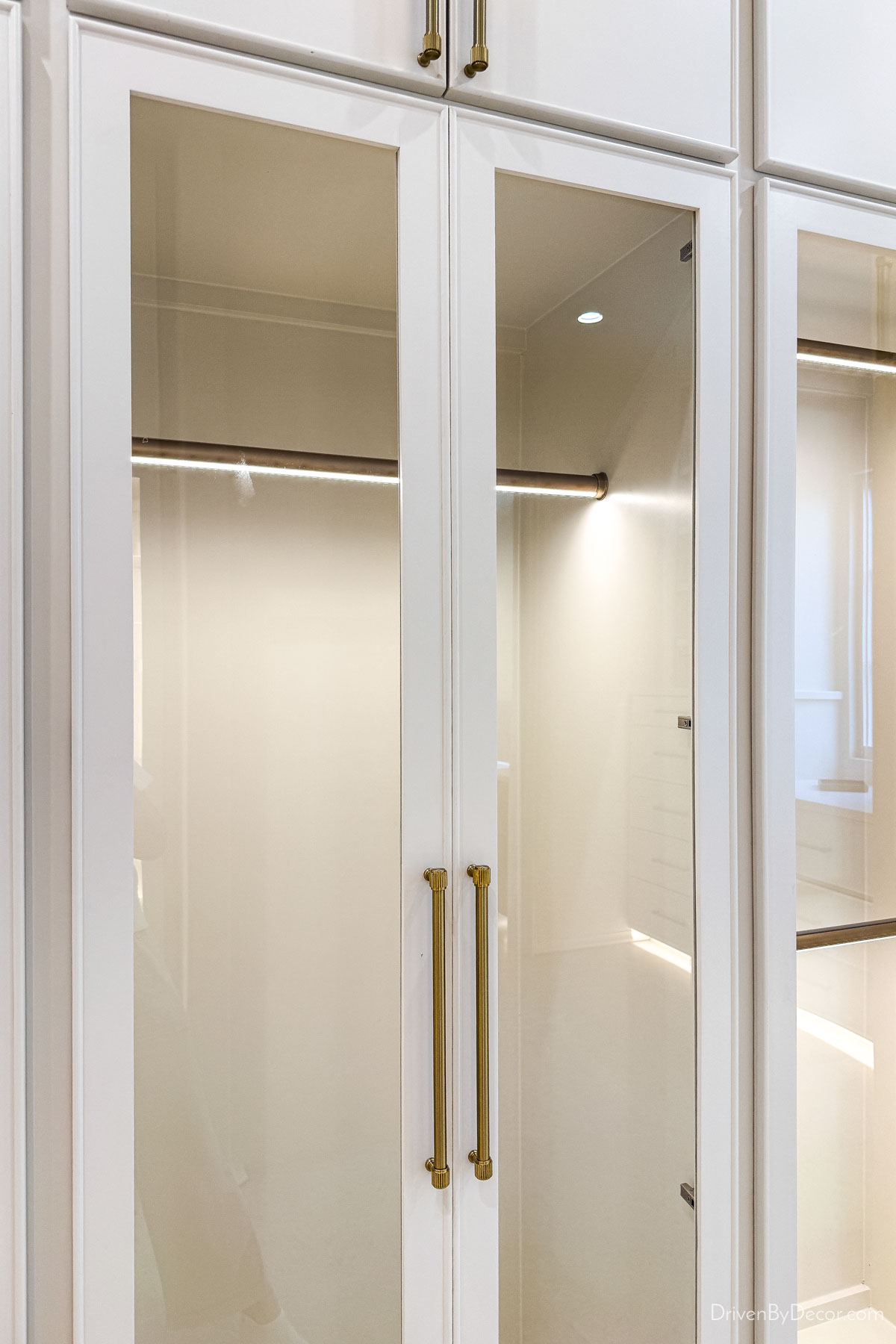 Illuminated closet rods in luxury home