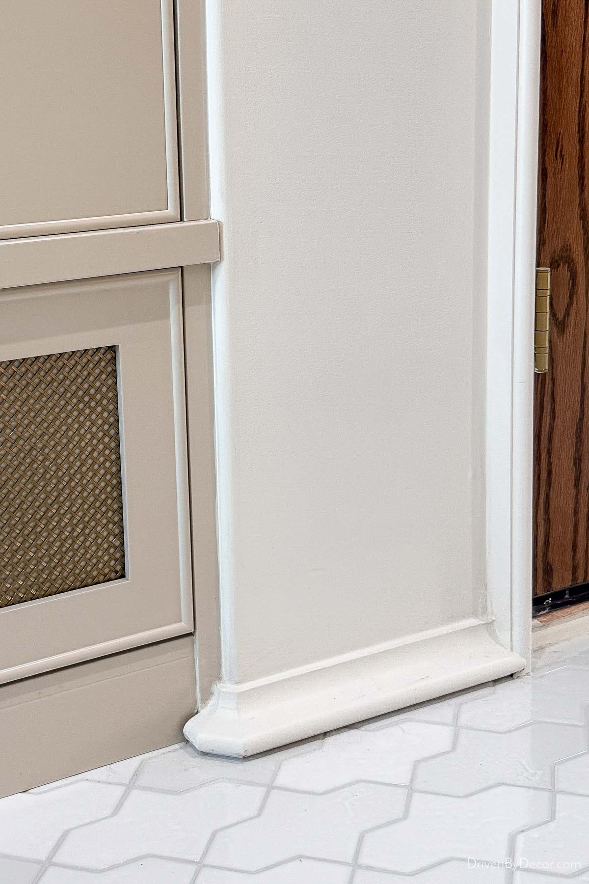 Small curved trim used as both casing and baseboard in luxury home design