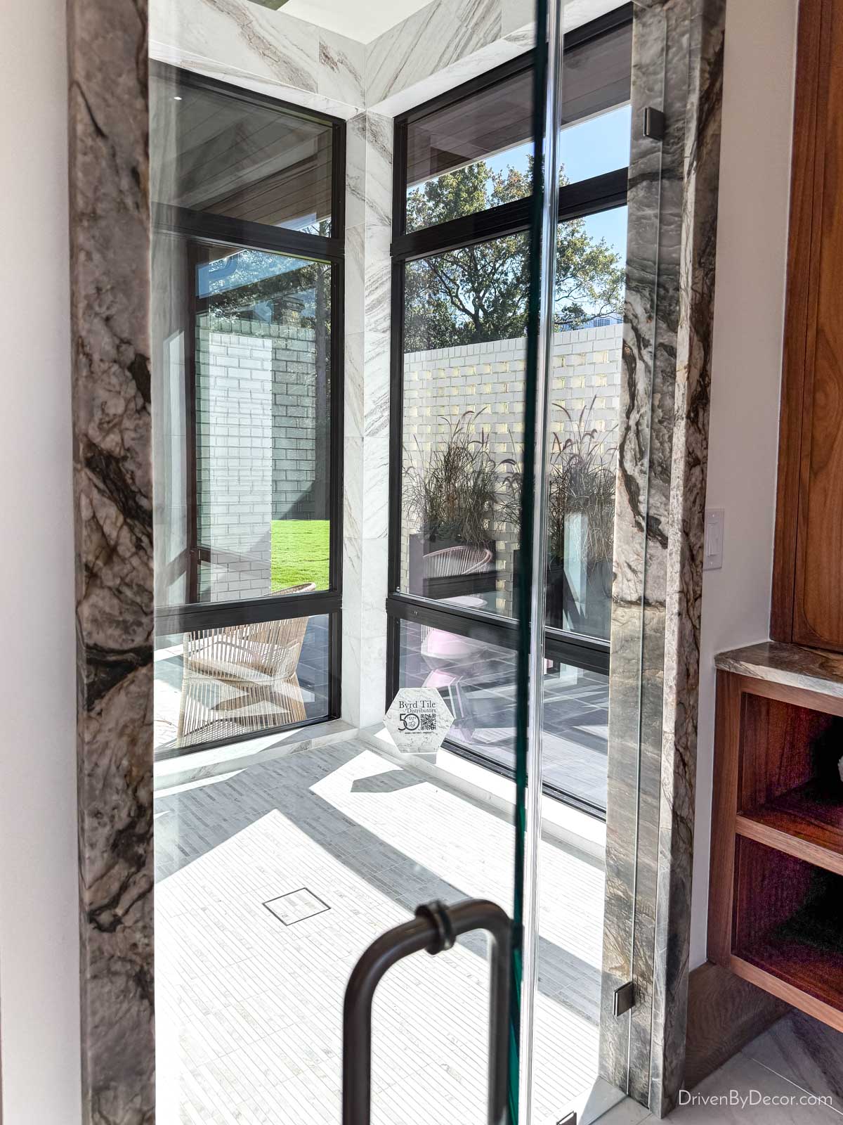 Indoor shower with glass on outside walls